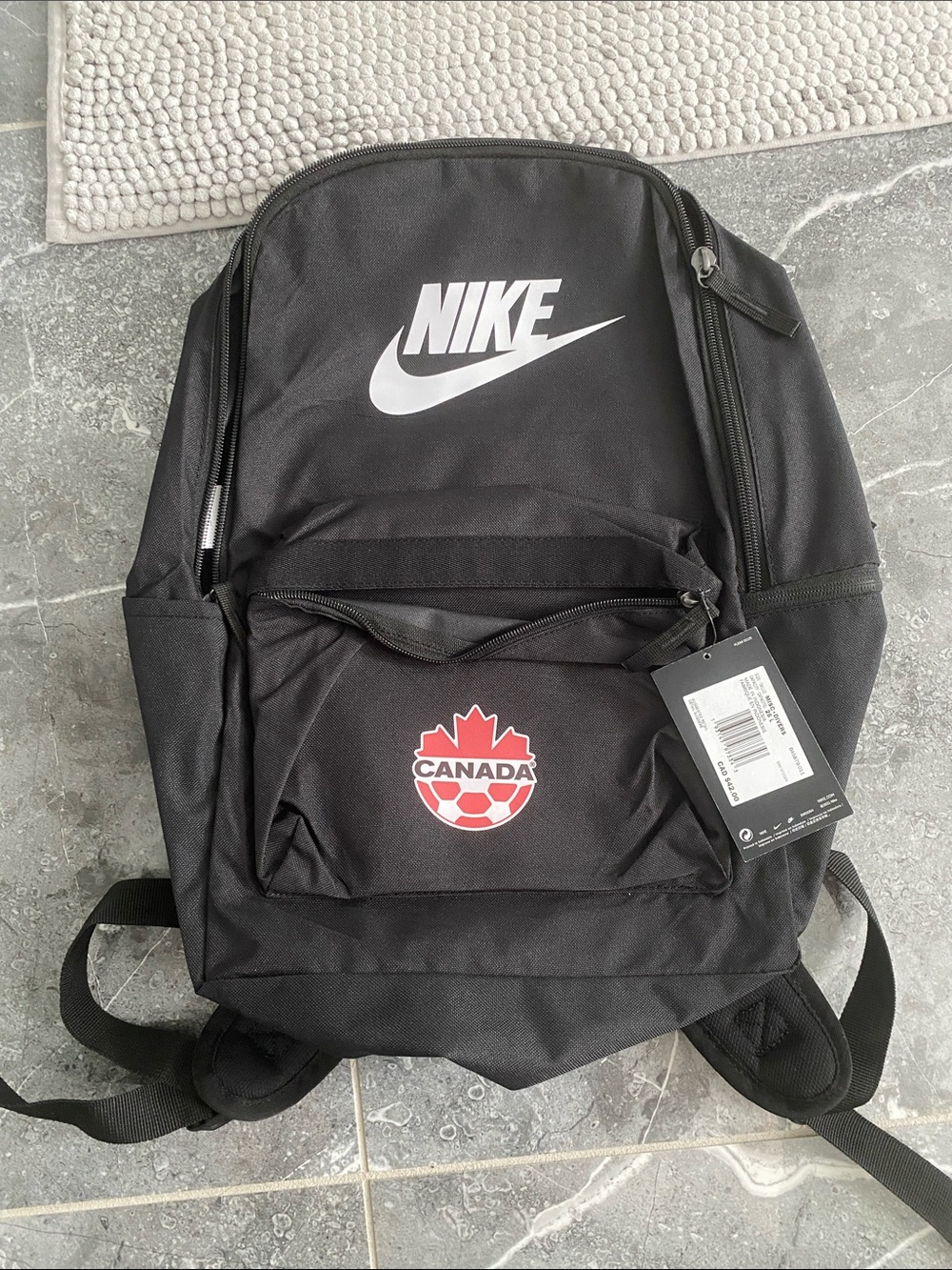 Nike Black Backpack with White Swoosh and Red Canada Emblem - Picture 1 of 1